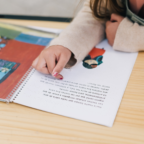 child speaking to adult child reading a book
